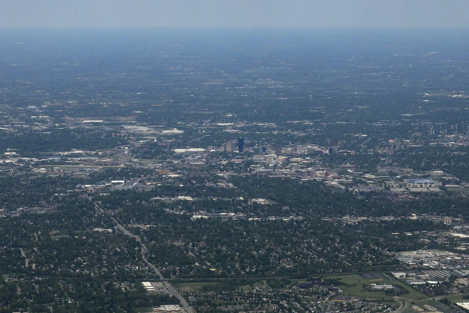 An aerial view of Lexington, with downtown in the center and neighborhoods stretching to the horizon