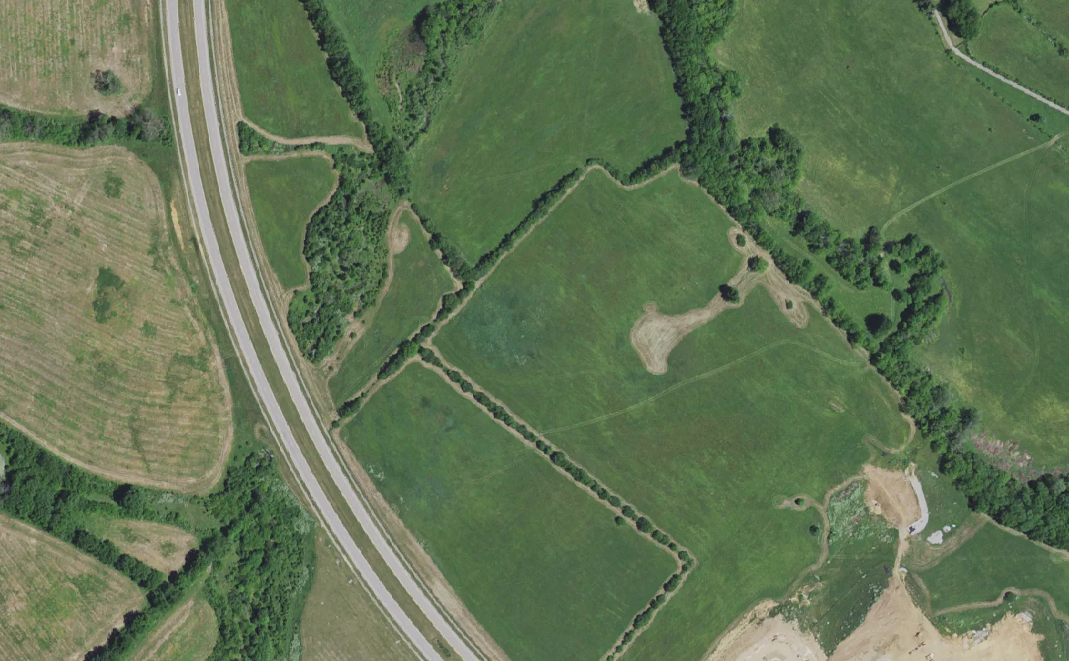 Polo Club Boulevard and the open land beside it in east Lexington where Mary E. Britton Middle School was later built, seen from the air