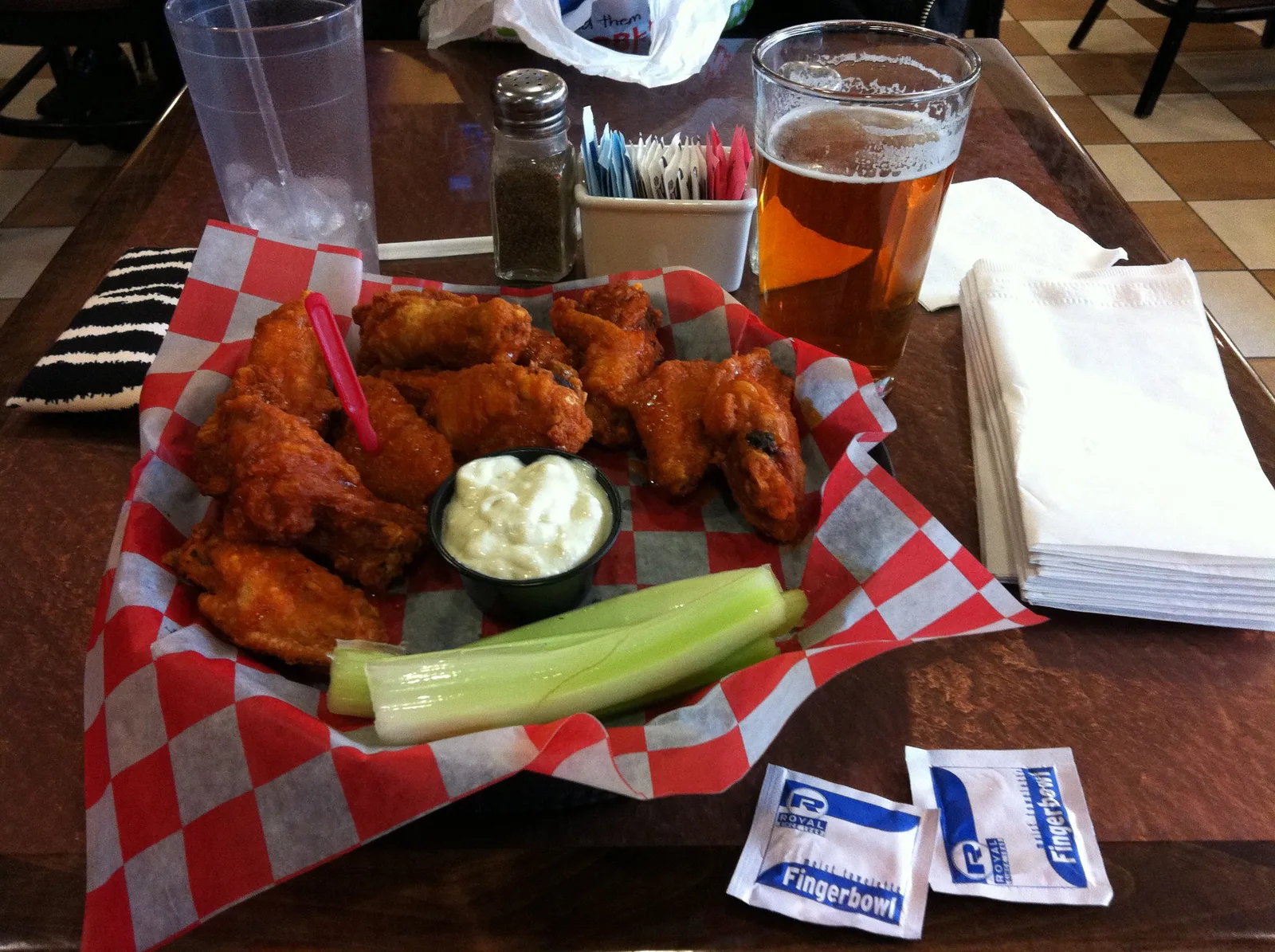 A basket of Buffalo wings with celery, blue cheese and a beer at the Anchor Bar in the Buffalo, N.Y., airport, a restaurant not on this list.